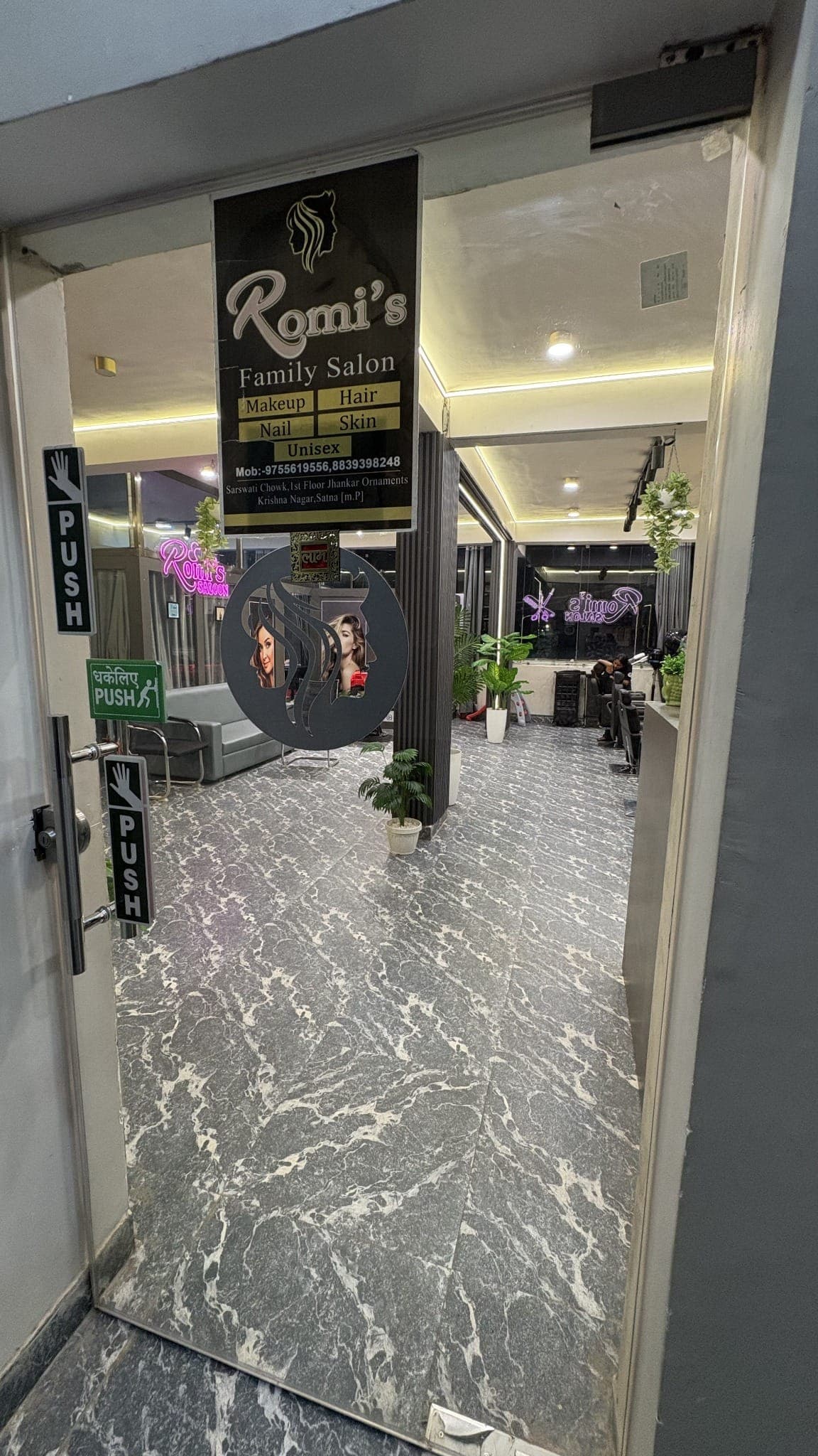 Romi's Family Salon entrance and signboard in Krishna Nagar, Satna