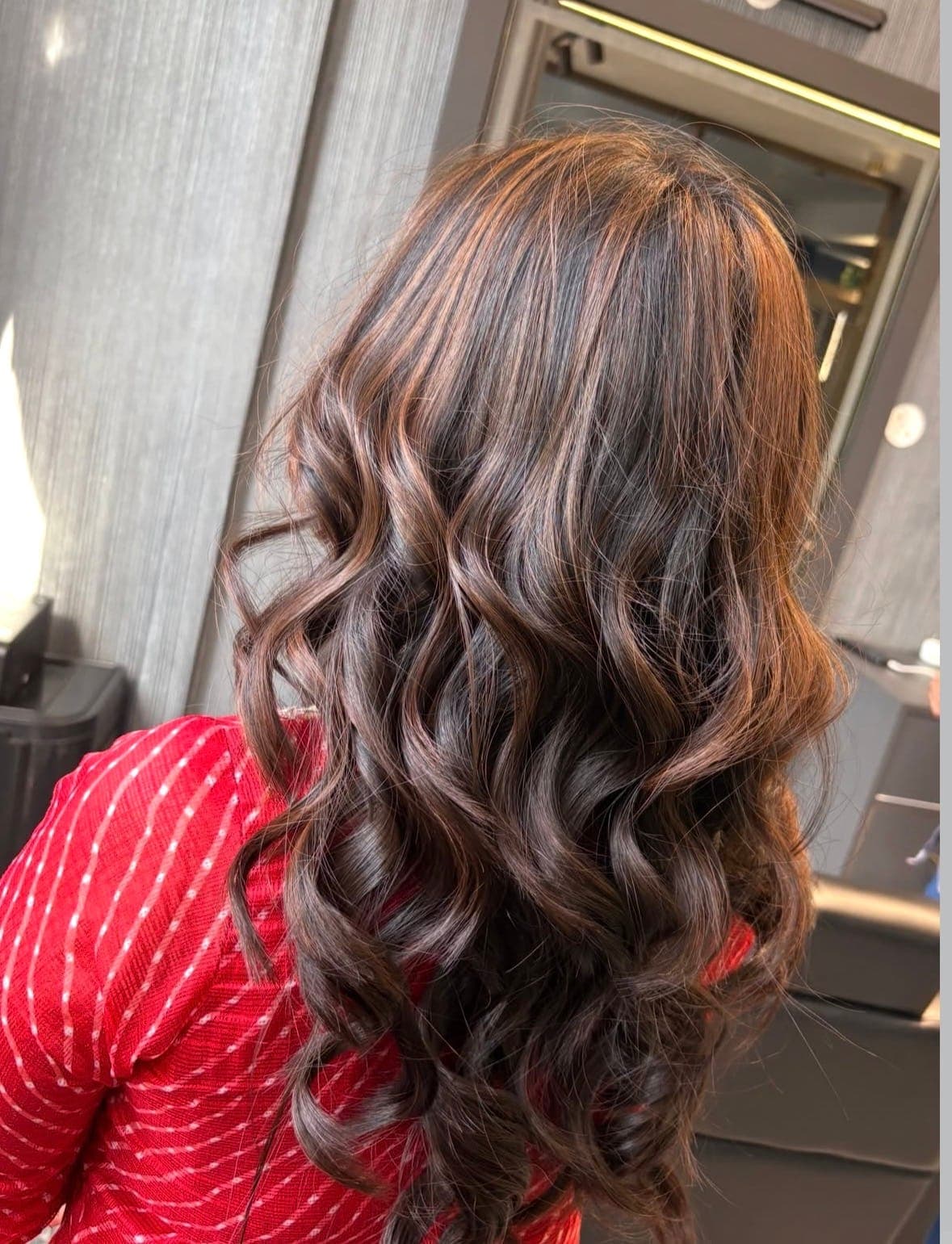 Finished hairstyle viewed from behind at Romi's Family Salon, Satna